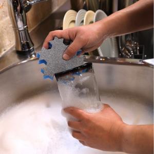 Cleaning the rim of a glass with the Scrubex Ninja Antimicrobial Sponge