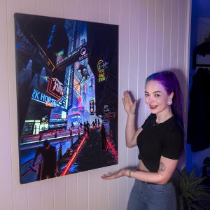 Nerdforge Martina in front of her latest creation, the Cyberpunk UV painting
