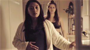 Samantha Cutaran holds her pregnant belly while Danielle Engelman worries about her girlfriend’s pregnancy.