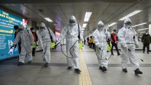 A team disinfects a common area in China