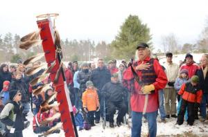 Tribal Leader Joe Mitchell conducts a ceremony in front of a crowd at a Wings of Wonder Bald Eagle release on tribal lands