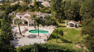 The exclusive neighborhood of La Cerquilla is famous for its views of Golf Valley, and this villa is uniquely situated in an elevated position, front line to Los Naranjos Golf Course.