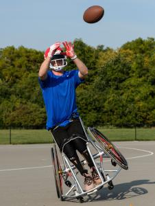 Wheelchair Football Player Getting Ready to Catch the Ball