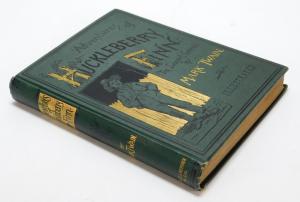 1885 first-edition copy of the Mark Twain classic book The Adventures of Huckleberry Fin. Estimate: $1,000-$1,500.