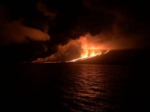Galapagos volcano erupting at night