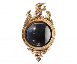 Regency looking glass, English, 19th century, labeled Thomas Fentham & Co., about 55 inches tall. Estimate: $2,500-$5,000.