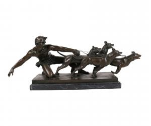 Bronze sculpture by Alexandre Kelety (French, 1874-1940), titled The Release, depicting a man holding four dogs on a leash, signed “Kelety”. Estimate: $3,000-$5,000.