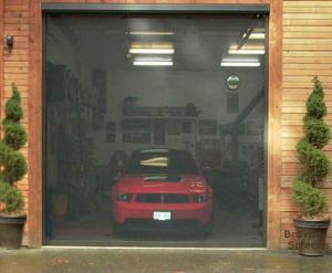 Motorized garage door screen