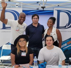 Photo of Founder, D'Andre D. Lampkin and Board Member, Tywanna Hill joining volunteers at Ontario Hispanic Chamber of Commerce  Street Festival