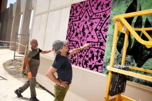 Marc Bennett oversees "The History of the Star of David" art installation at Soroka Medical Center's Healing Garden