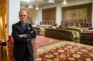 Behnam Rugs Owner, Ben Tavakolian, Stands in the Spacious Fine Rug Gallery