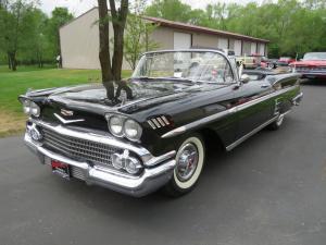 Magnificent 1958 Chevrolet Impala convertible, the first year for dual headlights and larger engine, black with a white soft top, with a 348 hp V8 engine.