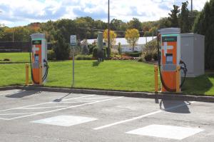 Two ChargePoint DC Fast Chargers for EV charging in a parking lot at Bally's Twin River Casino