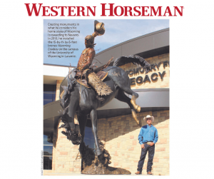 Artist Chris Navarro with Wyoming Cowboy monument at the University of Wyoming
