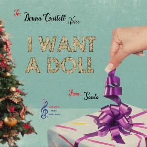 The cover is a Christmas-present tag that says: to Donna (Voice) from Santa.  The title is in large text: "I Want a Doll"   Also, there's a feminine hand in the lower right pulling up on a ribbon to a present box.