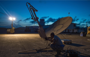 Staff Sgt. Trevor Black, 821st Contingency Response Support Squadron small package initial communications element technician, checks wires on a satellite communication antenna at Roosevelt Roads, Puerto Rico.