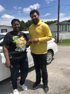 Brieanna C., an employee of EmployBridge, has her new vehicle delivered from a CARite dealership on the DriveItAway program