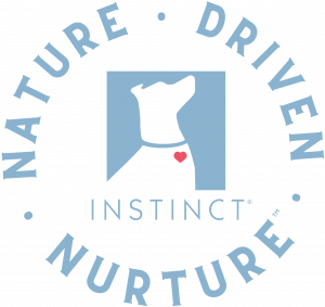 The Nature-Driven Nurture Instinct, which shows an icon of a dog, looking up, with the word "INSTINCT" below, and the words "Nature-oriented food" forming a circular border around them.