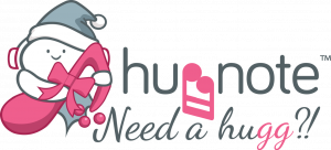 Huggnote logo which shows Huggy - the Huggnote mascot - a cute character in a Christmas bow holding a pink music note and two music notes facing each other as though hugging
