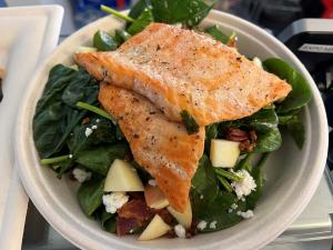 Tasty Salmon Served on a Bed of Fresh Spinach
