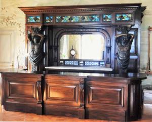 Beautifully carved mahogany stained glass bronze bar from a mansion in Newport, RI, made in Europe, 19th century ($19,200).