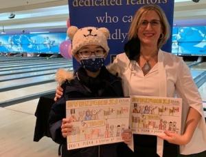 Amy Yao, a fifth-grader at PS 56, Rossville, is joined by Rosanne La Fata, chair of SIBOR’S Diversity Committee, as she displays her original artwork on the front cover of SIBOR'S Fair Housing Calendar.