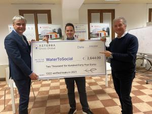 ASTERRA's CEO Elly Perets presents a check to Water-2-Social in Italty