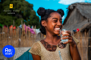 girl drinking water charity digital banking