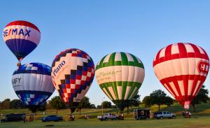 Hot air balloons (left to right) RE/MAX, UNIFY, Plano, Central Market and HEB at Oak Point Park in Plano, Texas