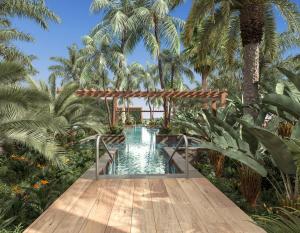 A view of the Evera Outdoor Pool at the Amanti, MadeForTwo Hotels in Ayia Napa, Cyprus. A secluded outdoor pool with jetsets and spa-type features, ideal for couples to enjoy leisure together in paradise.
