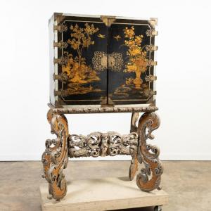 Late 18th/early 19th century Guillaume et Marie parcel in gold and black lacquer Japanese style cabinet on foot ($10,625).