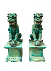 Large pair of Chinese turquoise glaze terracotta foo dogs on stands, 42 inches tall (est. $1,500-$2,500).