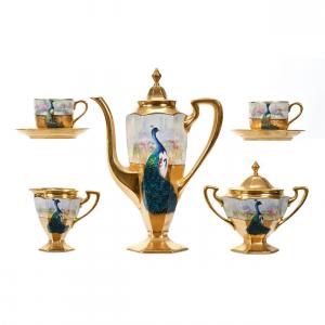 Coffee set marked Pickard decorated with peacocks and all over gold, artist signed Falatek, including a coffee pot, matching cream and sugar, two cups and two saucers.