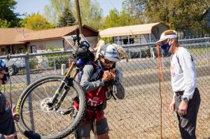 Marco Amselem, CEO and founder of Pasokin, attaches a bike in his back during the 2022 Oregon Expedition - America's Toughest Race