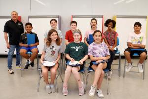 Picture of 9 students in the sixth grade engineering club, accompanied by Energia's Dr. Chuck Russo.