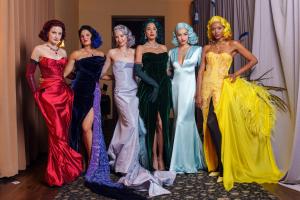 Six models wearing iconic re-created dresses Judy Garland wore made by House of Racanelli