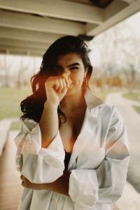 Samantha Spano holds a flower