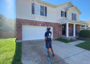 One of our employees finishing a house wash.
