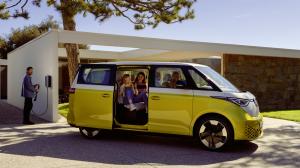 ICONIC VW CAMPERVAN ID.BUZZ WITH A FUTURISTIC NEW LOOK, STATE OF THE ART TECHNOLOGIES ALONG SIDE ITS UNIQUE CHARM SHOWN IN FULL VIEW WITH LOWER HALF YELLOW AND UPPER HALF WHITE