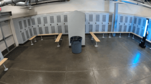OhmniClean Autonomous UV-C Disinfection Robot in a locker room