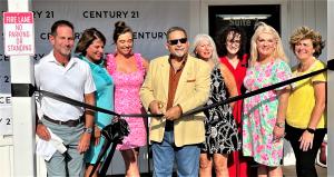 County Commissioner Mike Forte cuts the official ribbon at the opening of the CENTURY 21 Collective. Pictured: Co-owners Stephen Votino, Lisa: Myers, Lindsey Jenkins, Commissioner Forte, Marguerite Greene, Stephen Votino and Lindsey Jenkins, and Michelle Robson.