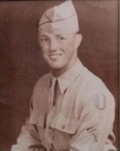head shot of Ellis Regnier- in Army uniform with sergeant stripes