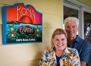 Steve and Joanie Wynn stand in front of Kona Earth sign