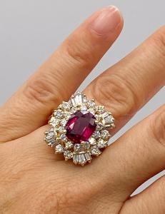 Burmese ruby ​​and diamond ring featuring a 4.41 carat natural Burmese ruby ​​surrounded by round and baguette diamonds set in 14k yellow gold, retailing for over $100,000 (est. $80,000 - $90,000 ).
