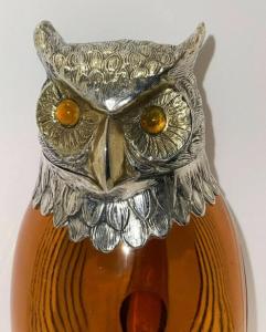 Visually striking Spanish silver and amber crystal figural owl-shaped claret jug, featuring intricate textured feather and eye details (est. $1,000-$4,500).