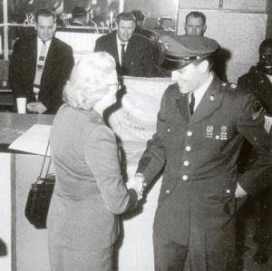 Elvis Presley, then a soldier, in 1960 at a press conference in Germany, saluting Marion Keisker MacInnes, an Air Force captain who earlier at Sun Records helped launch Elvis' career.