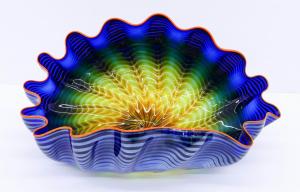 Large and impressive blown glass creation in the shape of a deep blue sea by Dale Chihuly (Washington, b. 1941), titled Ultramarine Blue Seaform with Red Orange Lip Wrap (1995) (est. $6,000-$9,000).