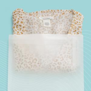 A shirt inside of a Vela™ paper bag