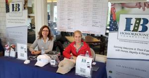 HonorBound Director of Program Services Sue Tosto, left, and Executive Director Pamela Harper Kushner greeted players, collected donations, and passed out information on the nonprofit organization on the porch of the Silvermine Country Club clubhouse duri