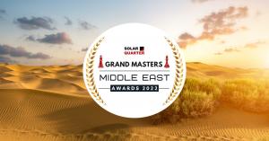 An award badge that reads "SolarQuarter Grand Masters Middle East Awards 2022" overlayed on a background of a desert landscape.